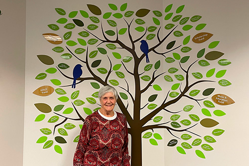 Eileen with the Oasis Tree behind her